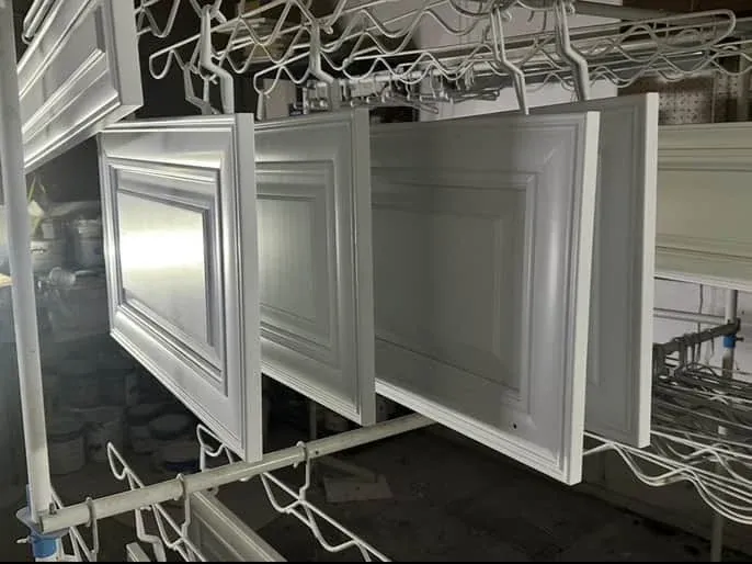 Cabinet doors curing inside Grove Street Painting spray shop