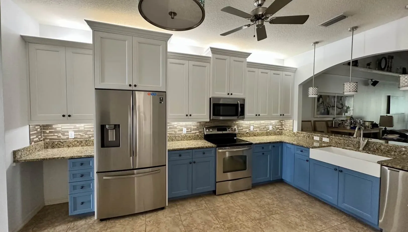 Two-tone Sarasota kitchen with navy lowers and white uppers