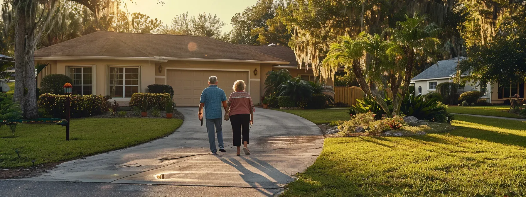 Sarasota homeowners admiring their freshly repainted coastal exterior