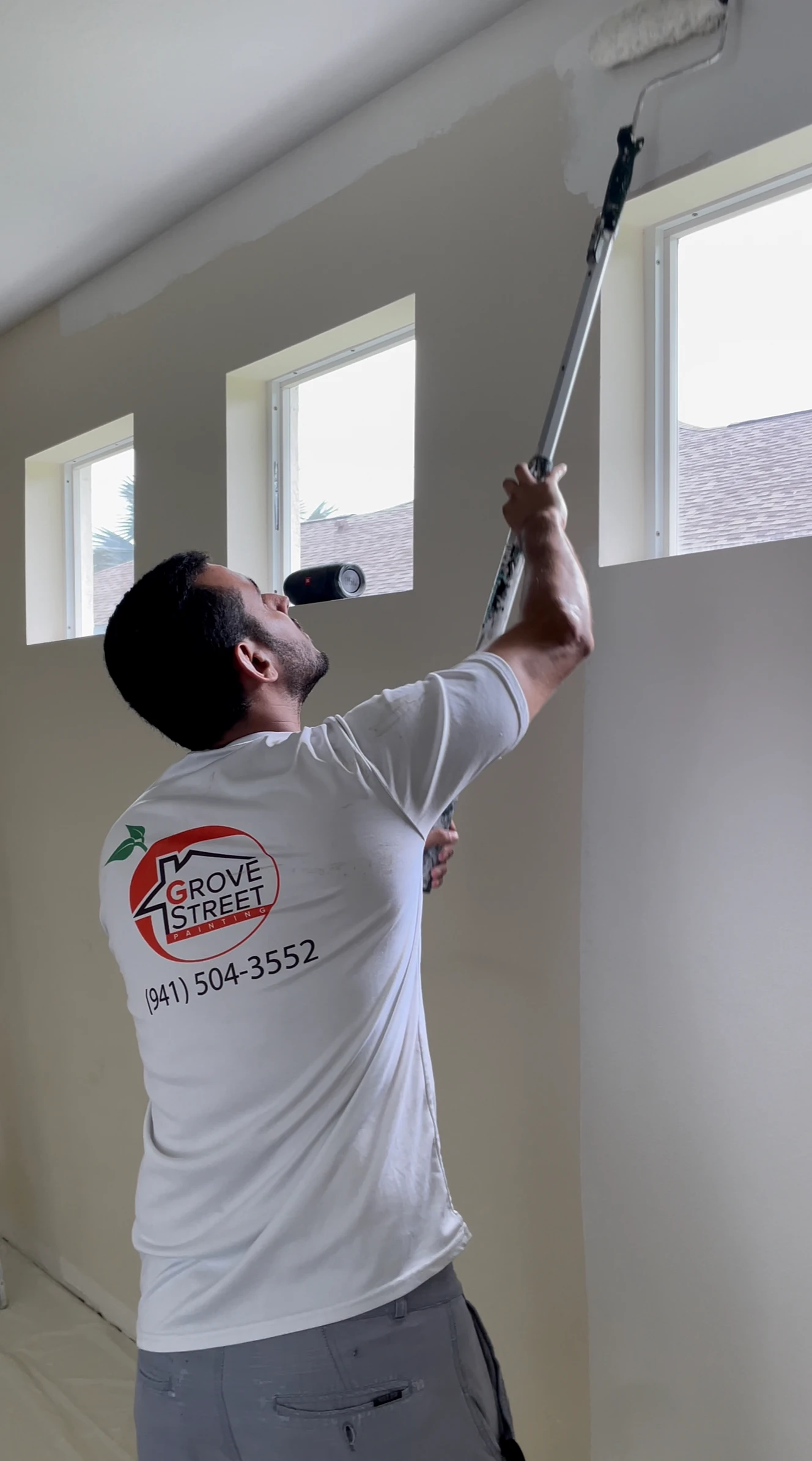 Sarasota interior painter rolling walls with premium low-VOC coatings