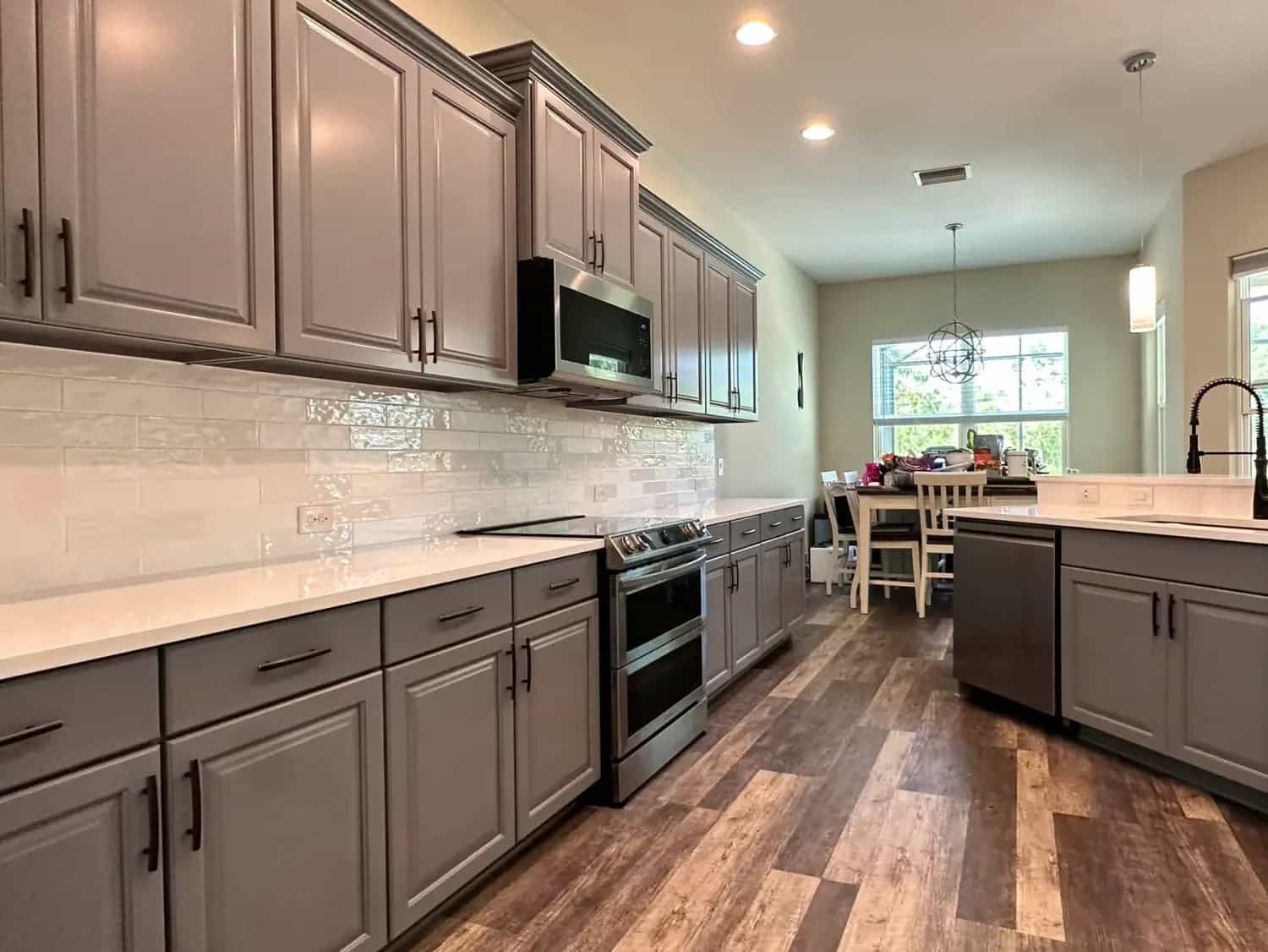 Factory-smooth cabinet painting finish in a bright kitchen