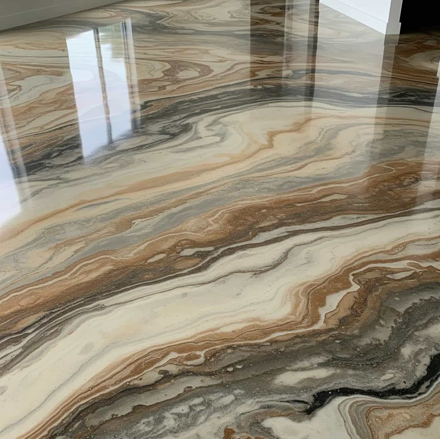 Professional epoxy flooring installation with clean flake finish in a garage