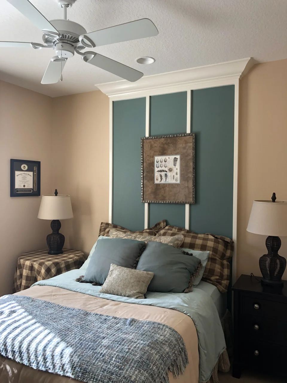 Bedroom with a teal board-and-batten accent wall behind the headboard
