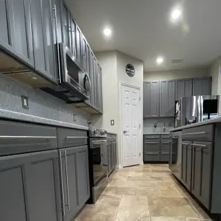 Sarasota cabinet painting - Modern kitchen with matte black accents