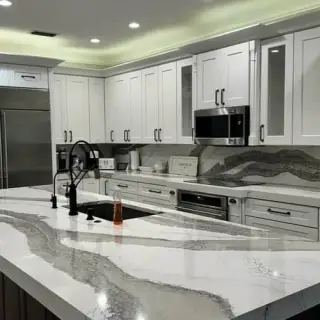 Cabinet painting in Sarasota - White cabinets with marble island