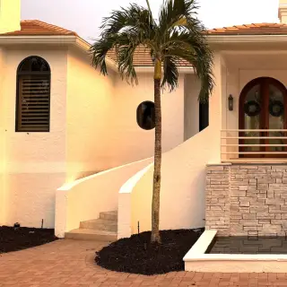 Exterior painting in Sarasota - Coastal home with palm trees