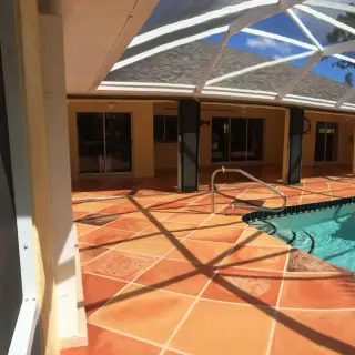 Concrete coating Sarasota - Lanai enclosure with faux stone floor