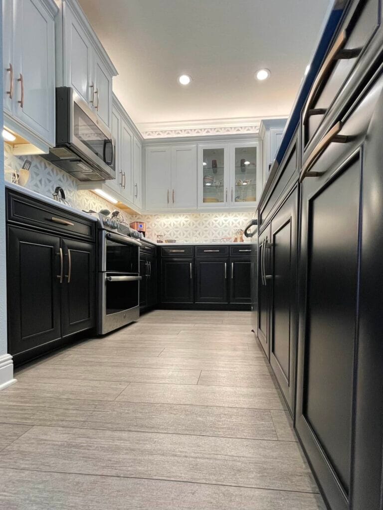 Transformed kitchen cabinets by Grove Street Painting showcasing cost-effective cabinet painting techniques in Sarasota.